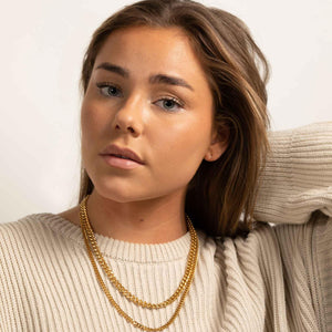 Model wearing two layers of 18k gold plated chains cuban link 