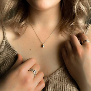 model wearing silver dripple necklace